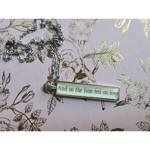 The Lion Fell in Love pendant necklace made with Twilight book pages